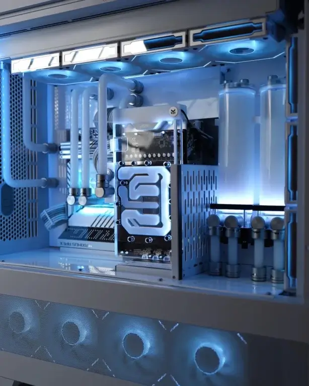 Blue themed custom water-cooled PC build with dual reservoirs and precision loop layout
