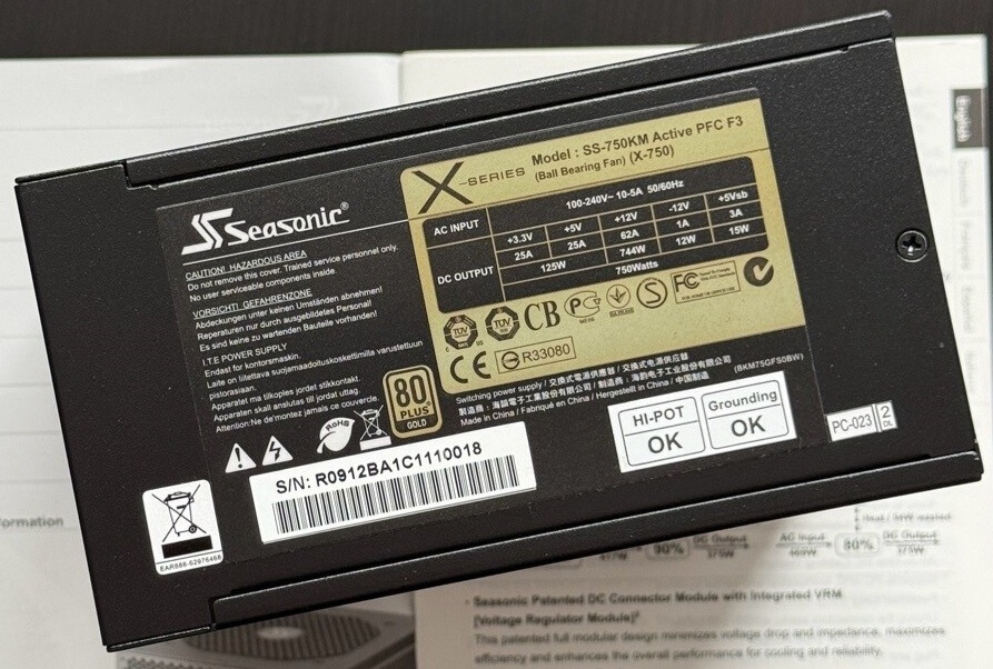 Seasonic X-Series 750W displayed in a museum-style case